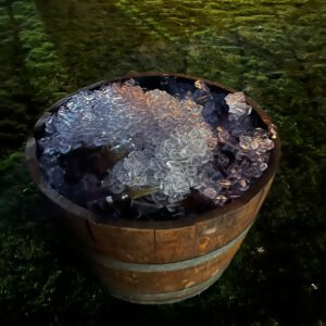 Half wine barrel used as rustic decor at a Melbourne and Bendigo event.