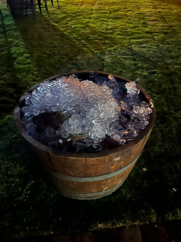 Half wine barrel used as rustic decor at a Melbourne and Bendigo event.